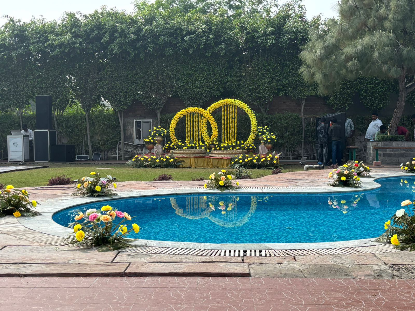 Yellow marigold haldi setup by the pool
